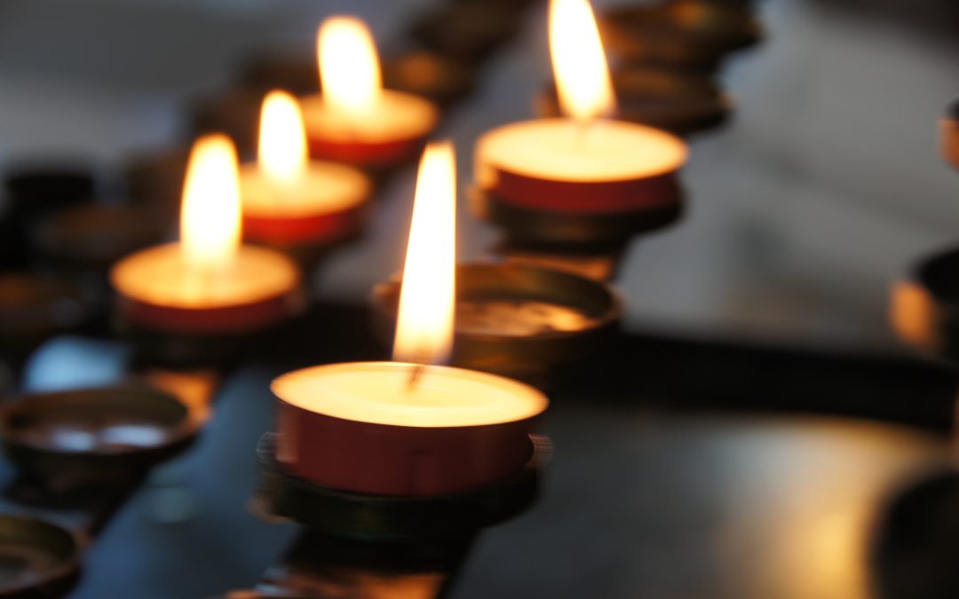Tea light candles lit in a church