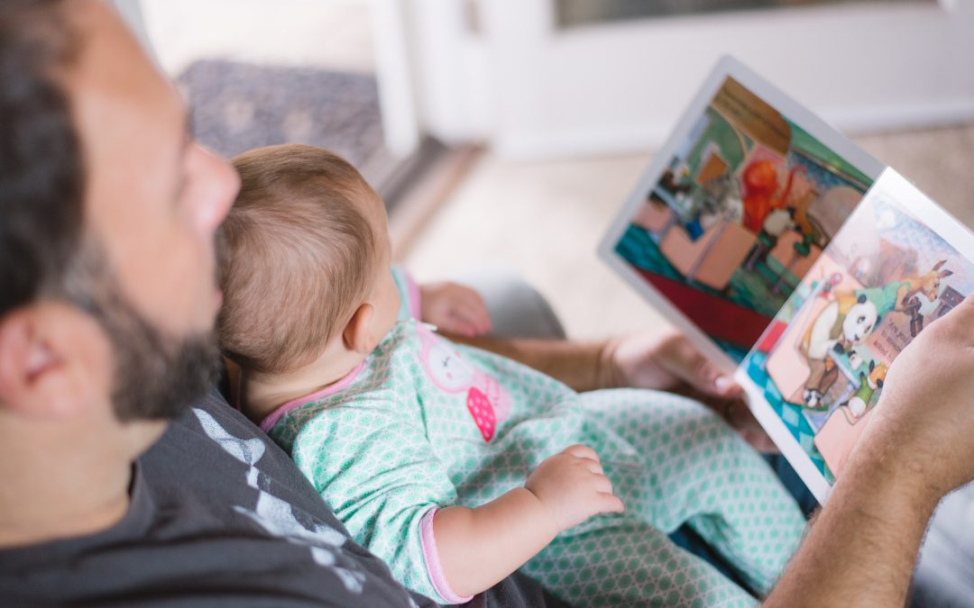 Father reading book to child