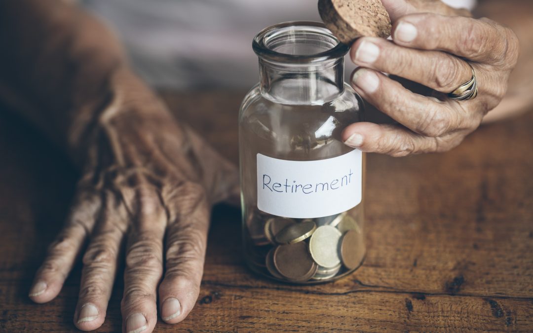 A jar of coins marked 'retirement' with elderly hands opening the jar
